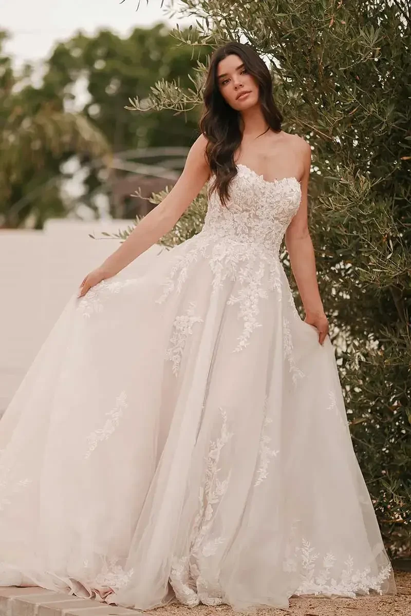Bride trying on a wedding gown at Jayne's Bridalwear